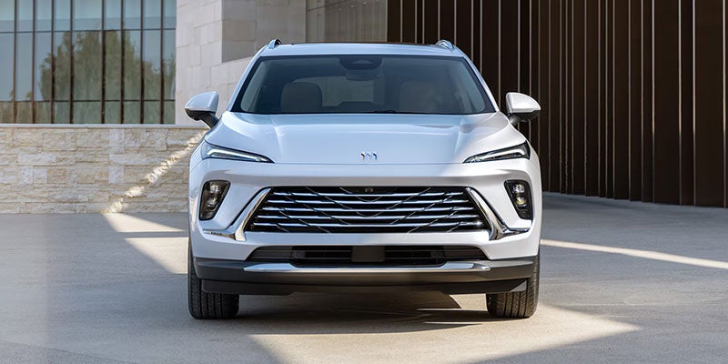 2025 Buick Envision silver SUV parked outdoor